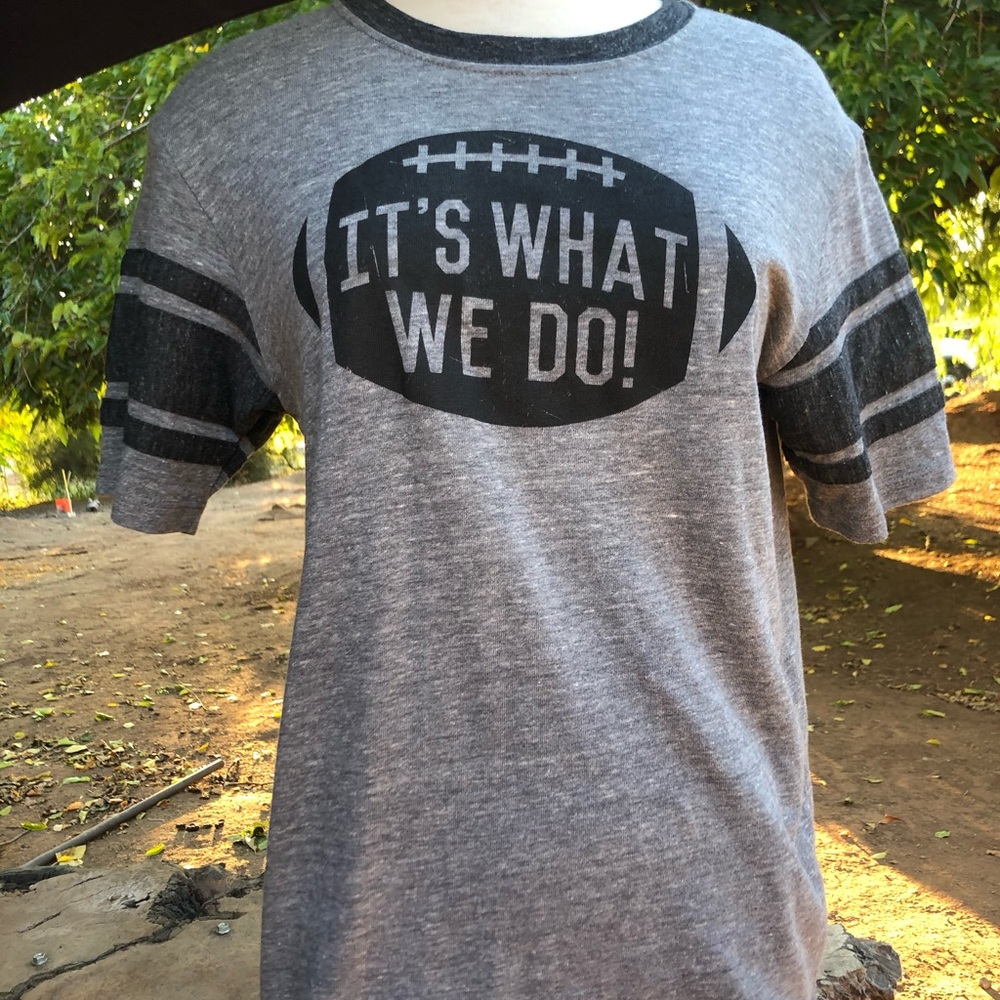 It’s what we do football shirt NWT size M
